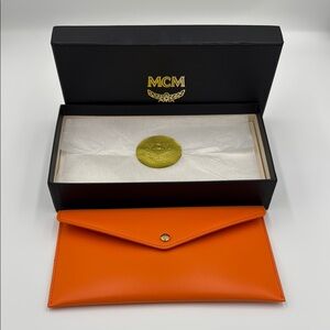 MCM Vibrant Orange Leather Clutch